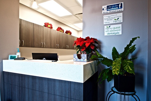 Waiting room view of dental office reception desk