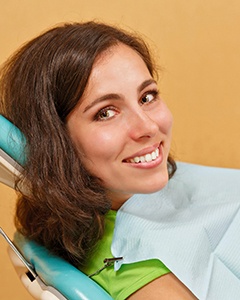 Happy patient during dental checkup and cleaning in Crookston