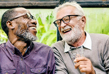 Older men in Crookston smiling with implant dentures