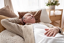 Man resting on a couch