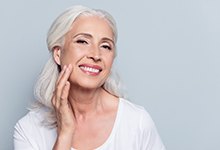 Woman enjoying a natural-looking smile with dental implants