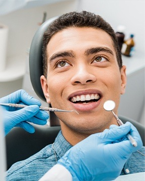 Man getting teeth checked
