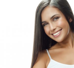 woman smiling with porcelain veneers