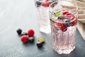 Sparkling water with raspberries and blueberries