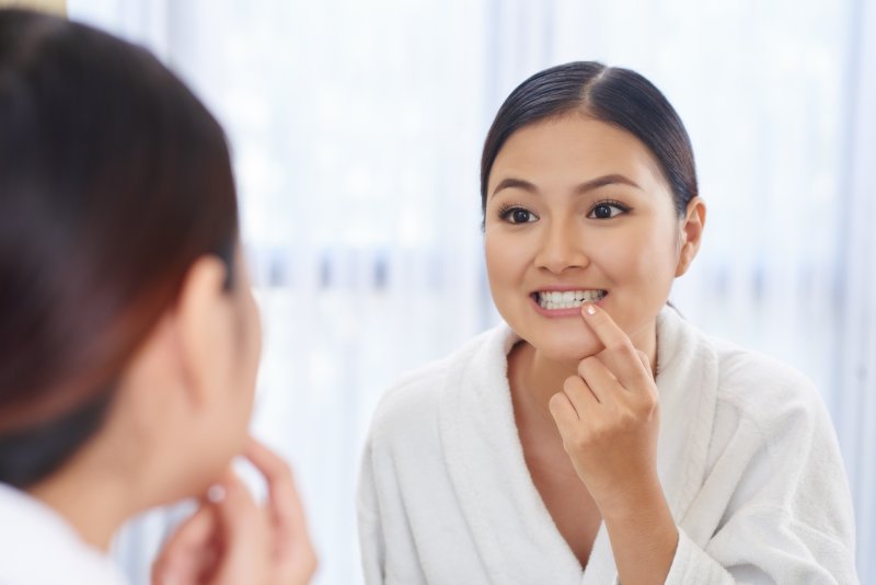 Woman looking at teeth