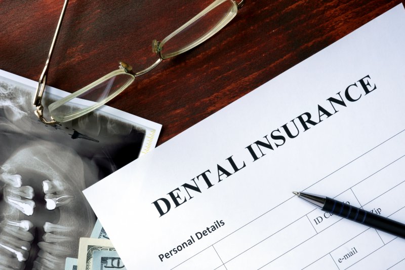 A dental insurance form sitting on a table.