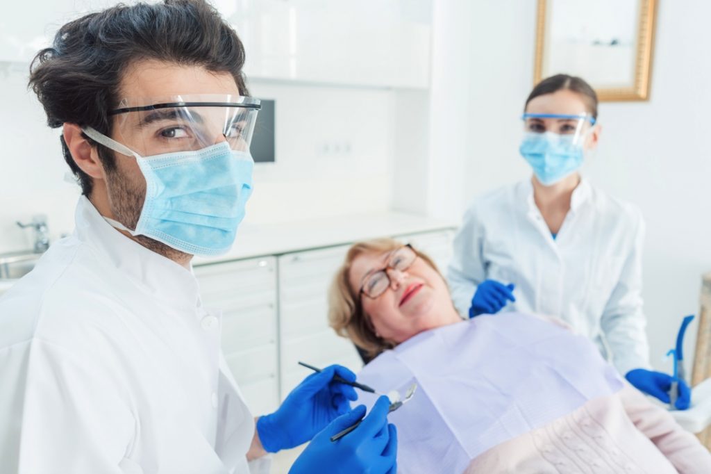 Dentists in Crookston wearing face shields during pandemic