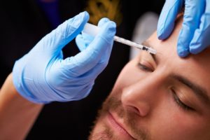 person receiving BOTOX in Crookston from a cosmetic dentist