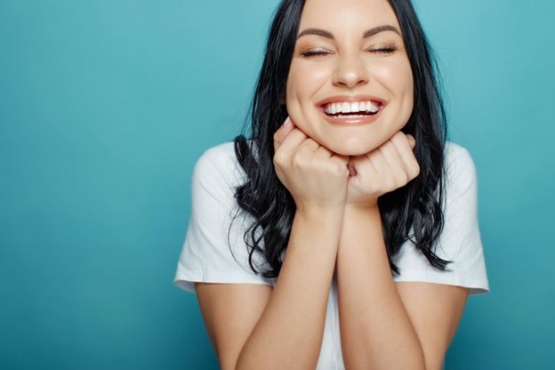 person showing off teeth after professional whitening treatment