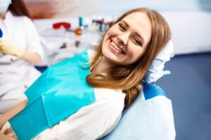 Woman smiling before dental implant surgery